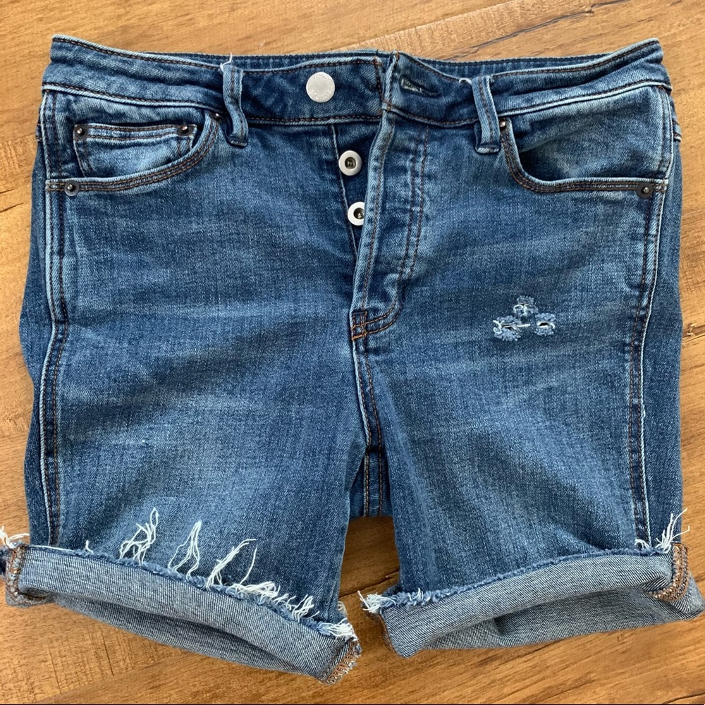 Mid-rise button-up skinny jeans cut into shorts